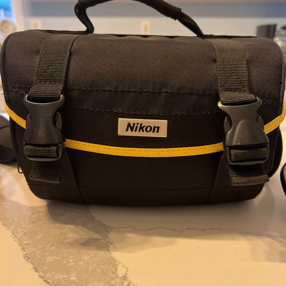 Canon EOS REBEL T1I. With EF-S 18-55 IS accessories. With carrying case.